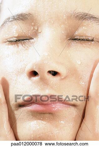 Stock Photo - Person's wet face, close-up. Fotosearch