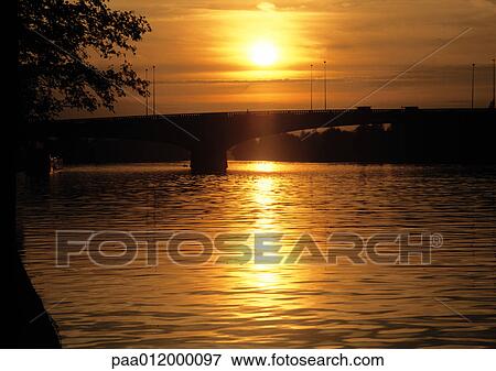 Sunset over water View Large Photo Image Stock Photo - Sunset over water. Fotosearch