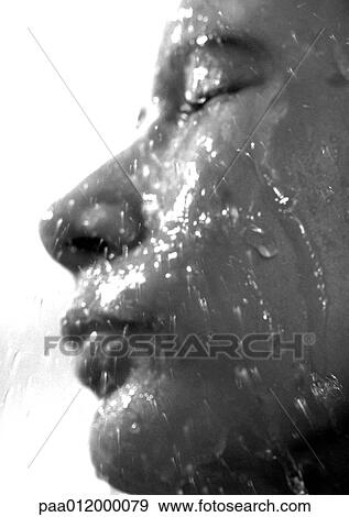 Water running over person's face, side view, close-up View Large Photo Image Stock Photo - Water running over person's face, side view, close-up. Fotosearch