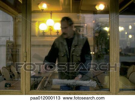 Window washer washing windows inside cafe View Large Photo Image Stock Image - Window washer washing windows inside cafe. Fotosearch