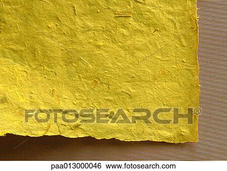 Corner of yellow-colored, recycled paper, close-up View Large Photo Image Stock Photograph - Corner of yellow-colored, recycled paper, close-up. Fotosearch