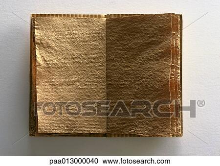 Stock Image - Open book made from recycled paper, close-up. Fotosearch