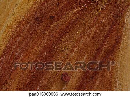 Yellow-brown pigments scribbled on textured surface, close-up, full frame View Large Photo Image Stock Photograph - Yellow-brown pigments scribbled on textured surface, close-up, full frame. Fotosearch