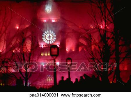 A pink lit clock tower at night, blurred in background. View Large Photo Image Stock Image - A pink lit clock tower at night, blurred in background.. Fotosearch