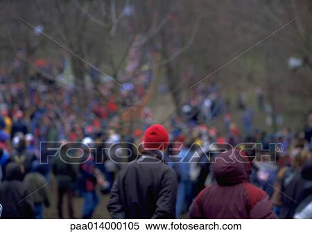 Crowd dressed for cold weather in park, blurred. View Large Photo Image Stock Photography - Crowd dressed for cold weather in park, blurred.. Fotosearch