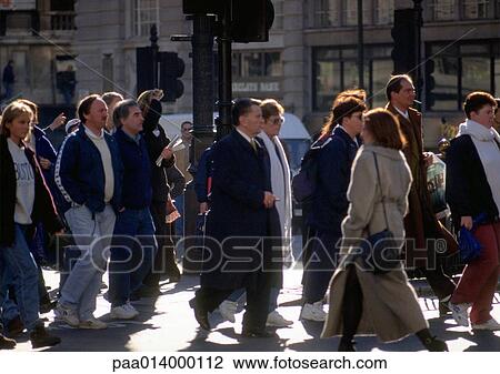 Crowd dressed warmly, walking in city, blurred. View Large Photo Image Stock Image - Crowd dressed warmly, walking in city, blurred.. Fotosearch