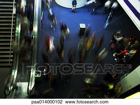 Crowd inside building, next to escalator, blurred motion, high angle view View Large Photo Image Stock Image - Crowd inside building, next to escalator, blurred motion, high angle view. Fotosearch