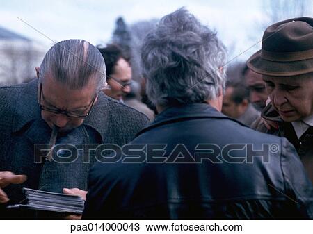 Stock Image - Crowd of men, close-up. Fotosearch