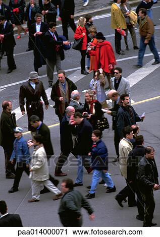 Stock Image - Crowd of people in street, high angle view. Fotosearch