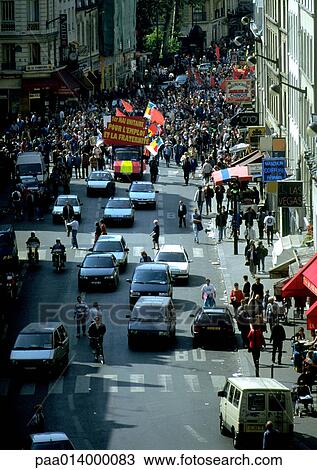 Stock Image - Crowd of people in street with banners. Fotosearch