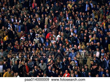 Crowd of spectators standing, full frame View Large Photo Image Stock Photo - Crowd of spectators standing, full frame. Fotosearch
