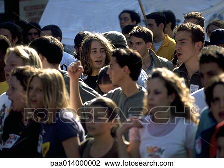 Stock Image - Crowd of young people, blurred.. Fotosearch