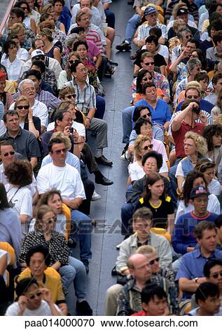 Crowd sitting in bleachers, blurred. View Large Photo Image Stock Image - Crowd sitting in bleachers, blurred.. Fotosearch