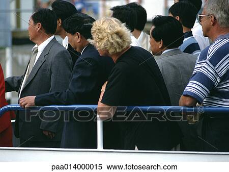 Crowd waiting by railing. View Large Photo Image Stock Photography - Crowd waiting by railing.. Fotosearch