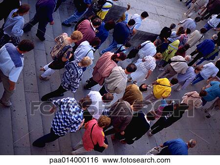Stock Photograph - Crowd walking down stairs, high angle view. Fotosearch