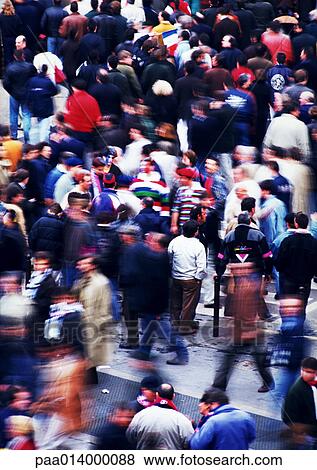 Stock Photo - Crowd walking in street, blurred.. Fotosearch