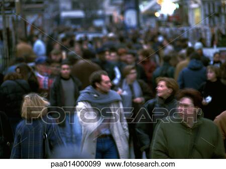Stock Photo - Crowd walking in street, blurred.. Fotosearch
