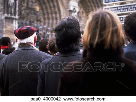 Stock Image - Group of people, close up from behind.. Fotosearch