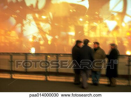Group of people standing in front of railing View Large Photo Image Stock Image - Group of people standing in front of railing. Fotosearch