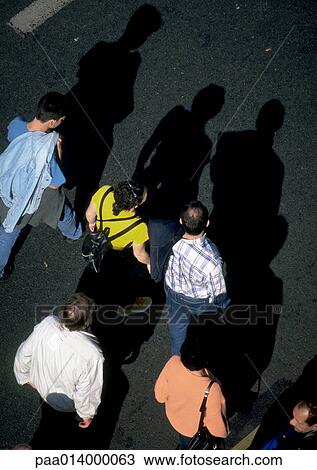 Group of people standing on asphalt, high angle view View Large Photo Image Stock Image - Group of people standing on asphalt, high angle view. Fotosearch