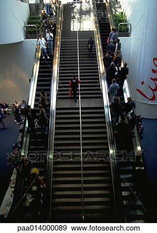 Stock Photo - People on escalators and stairs. Fotosearch