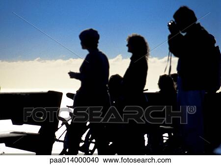 Stock Image - People taking photos, silhouette.. Fotosearch