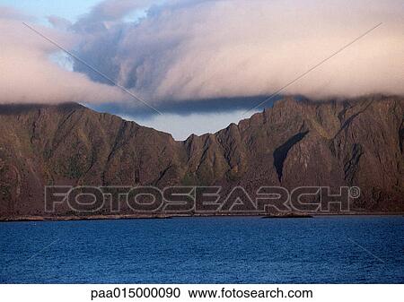 Cloud-topped mountains and sea View Large Photo Image Stock Image - Cloud-topped mountains and sea. Fotosearch