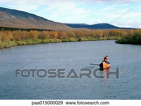 Finland, person in rowboat in lake View Large Photo Image Stock Photo - Finland, person in rowboat in lake. Fotosearch