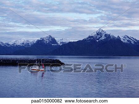 Norway, fishing boat close to jetty, snow-capped mountains in background View Large Photo Image Stock Image - Norway, fishing boat close to jetty, snow-capped mountains in background. Fotosearch