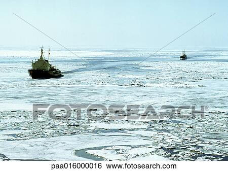 Stock Photograph - Baltic Sea, ships on icy water. Fotosearch