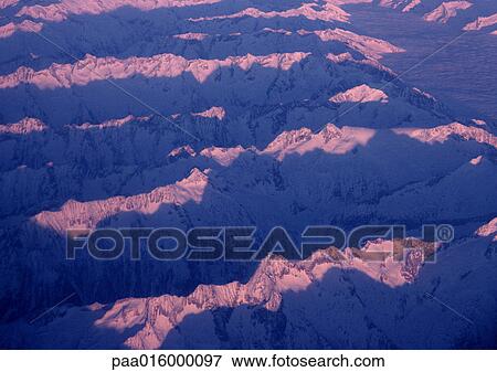 Stock Photo - Norway, snow-covered mountains, aerial view. Fotosearch
