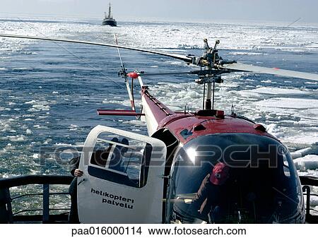 Picture - Scandinavia, helicopter on icy water. Fotosearch