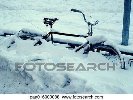 Sweden, bicycle buried in snow View Large Photo Image Stock Photo - Sweden, bicycle buried in snow. Fotosearch