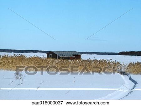 Stock Photo - Sweden, house in snowy landscape. Fotosearch