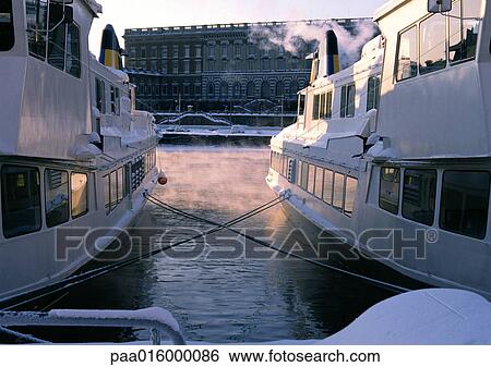 Sweden, Stockholm, view of building from between two docked yachts View Large Photo Image Stock Photograph - Sweden, Stockholm, view of building from between two docked yachts. Fotosearch