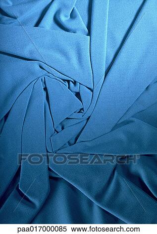 Stock Photography - Folded blue fabric, close-up, full frame. Fotosearch