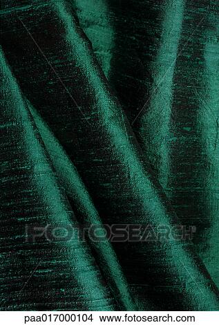 Picture - Folds in green fabric, close-up, full frame. Fotosearch