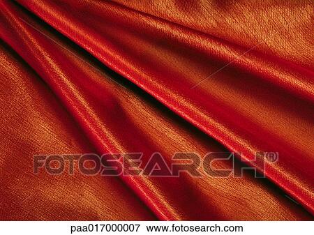 Folds in orange fabric, close-up, full frame View Large Photo Image Stock Photo - Folds in orange fabric, close-up, full frame. Fotosearch