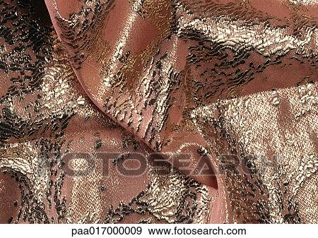 Stock Photo - Folds in pink and silver fabric, close-up, full frame. Fotosearch