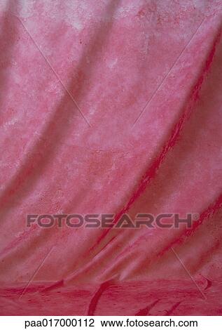 Stock Image - Mottled red fabric, close-up, full frame. Fotosearch