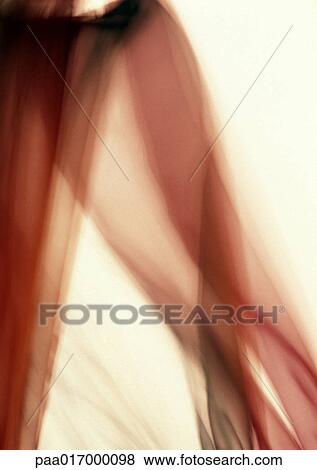 Stock Photo - Sheer red fabric, blurred. Fotosearch