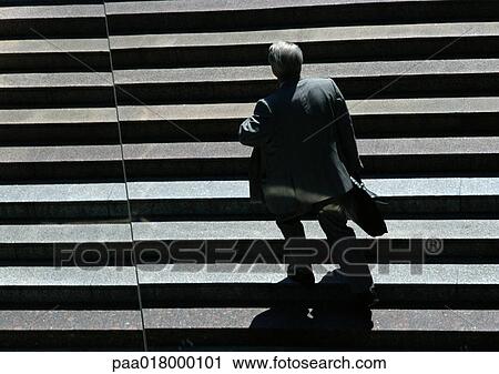 Businessman walking up stairs View Large Photo Image Stock Image - Businessman walking up stairs. Fotosearch