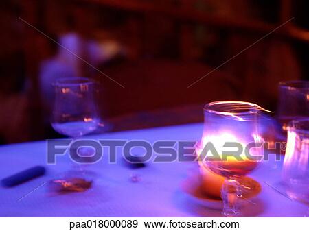 Candle on table, blurred. View Large Photo Image Stock Photo - Candle on table, blurred.. Fotosearch