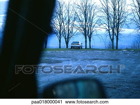 Car parked near water, view from another car. View Large Photo Image Stock Image - Car parked near water, view from another car.. Fotosearch