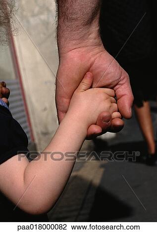 Child holding man's hand, close up. View Large Photo Image Stock Image - Child holding man's hand, close up.. Fotosearch
