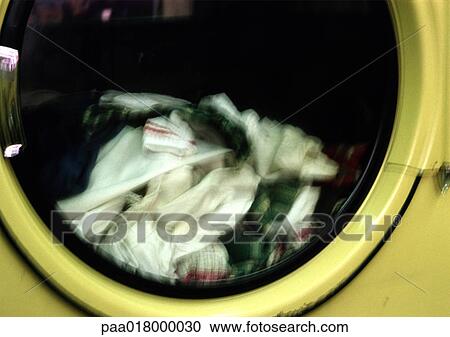 Stock Image - Close piled in dryer, blurred.. Fotosearch