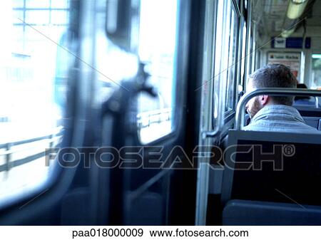 Man riding train, rear view. View Large Photo Image Stock Photo - Man riding train, rear view.. Fotosearch