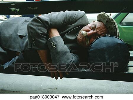 Man sleeping on park bench. View Large Photo Image Stock Photo - Man sleeping on park bench.. Fotosearch