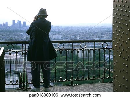 Man taking picture from balcony, rear view. View Large Photo Image Stock Photograph - Man taking picture from balcony, rear view.. Fotosearch