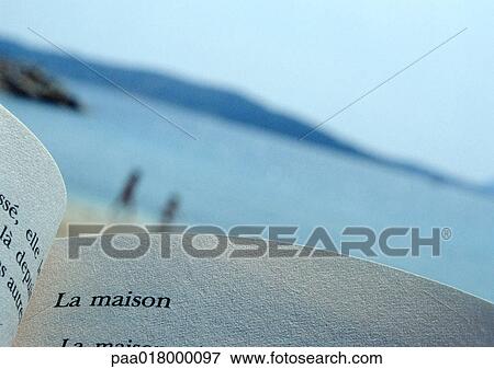 Open book, mountains and water in background. View Large Photo Image Stock Photo - Open book, mountains and water in background.. Fotosearch